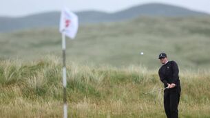 <p>Dominic Clemons of England chips during the semi finals on day five of The Amateur Championship at Ballyliffin Golf Club in Donegal. Picture: Oisin Keniry/R&amp;A</p>