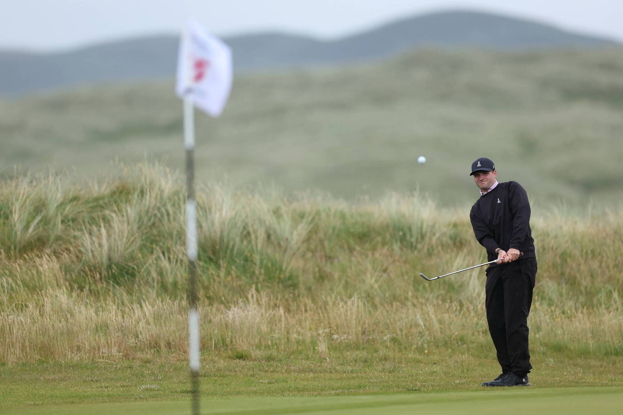 Dominic Clemons of England chips during the semi finals on day five of The Amateur Championship at Ballyliffin Golf Club in Donegal. Picture: Oisin Keniry/R&A
