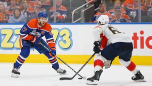 <p>GAME SEVEN: Connor McDavid of the Edmonton Oilers skates while Brandon Montour of the Florida Panthers defends during the 2024 Stanley Cup Final. Photo by Codie McLachlan/Getty Images.</p>