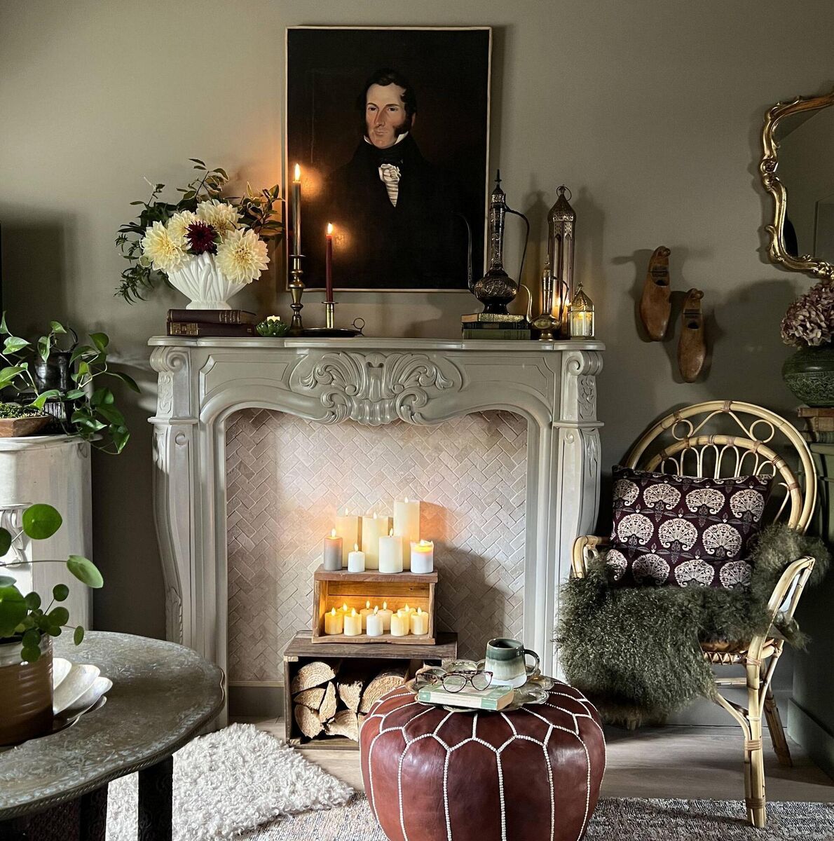  Sarah Twigg Doyle added a vintage fire surround to a blank wall in her living room to give it a focal point, styling it with LED candles and plant life. 