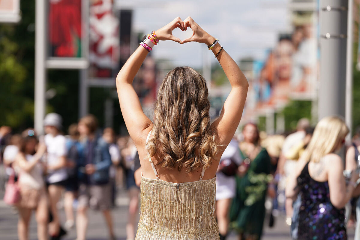 A fan poses outside one of Taylor Swift's Eras Tour concerts. Picture: Lucy North/PA Wire