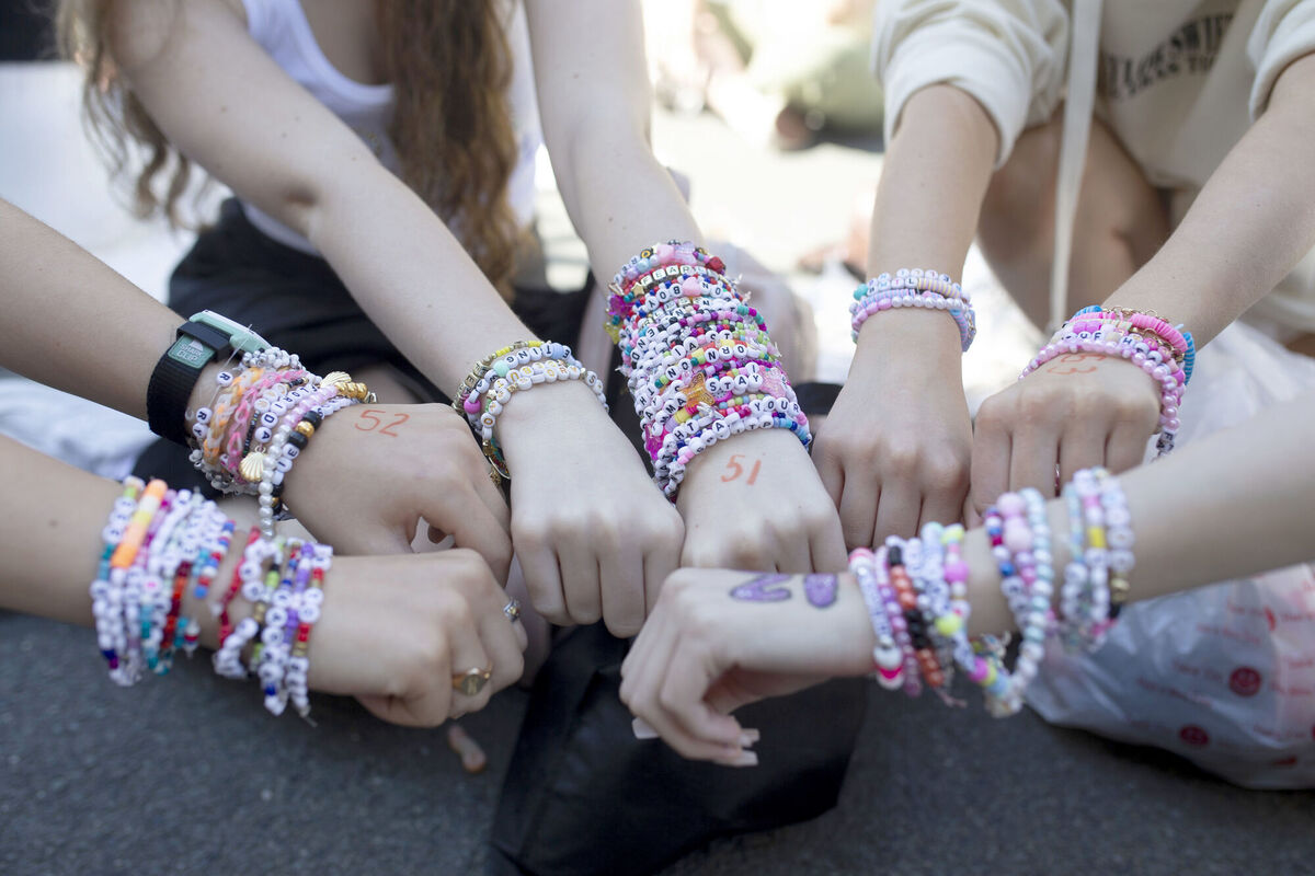 Taylor Swift fans display their bracelets. Picture: Charlotte Coney/PA Wire