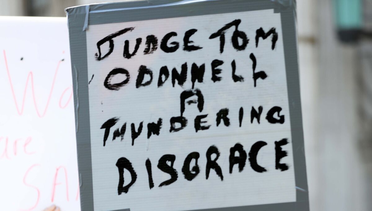 Protesters carry placards in anger over the suspended sentence handed down in the case. Picture: Sasko Lazarov/© RollingNews.ie