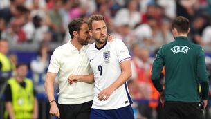 <p>England manager Gareth Southgate puts his arm round Harry Kane as he is substituted</p>