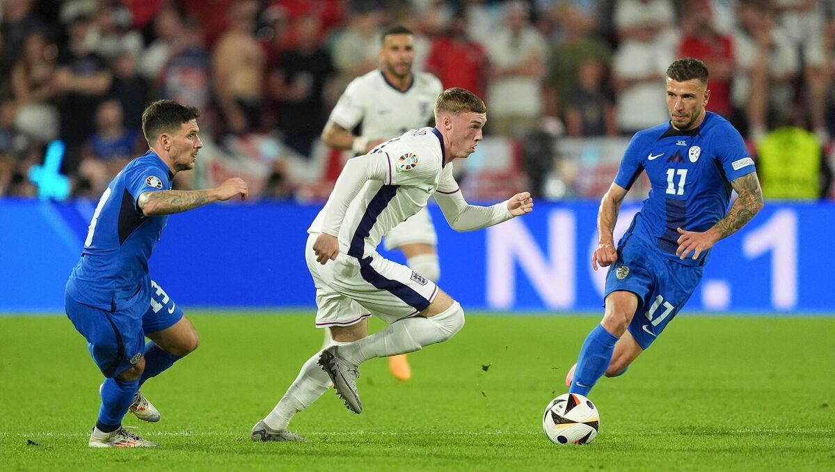 England's Cole Palmer (centre) attempts to go past Slovenia's Erik Janza (left) and Jan Mlakar. Photo: Martin Rickett/PA Wire. England's Cole Palmer (centre) attempts to go past Slovenia's Erik Janza (left) and Jan Mlakar. Photo: Martin Rickett/PA Wire.