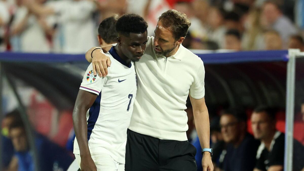 TOUGH TOURNAMENT: Bukayo Saka is embraced by Gareth Southgate. Pic: Richard Pelham/Getty Images TOUGH TOURNAMENT: Bukayo Saka is embraced by Gareth Southgate. Pic: Richard Pelham/Getty Images