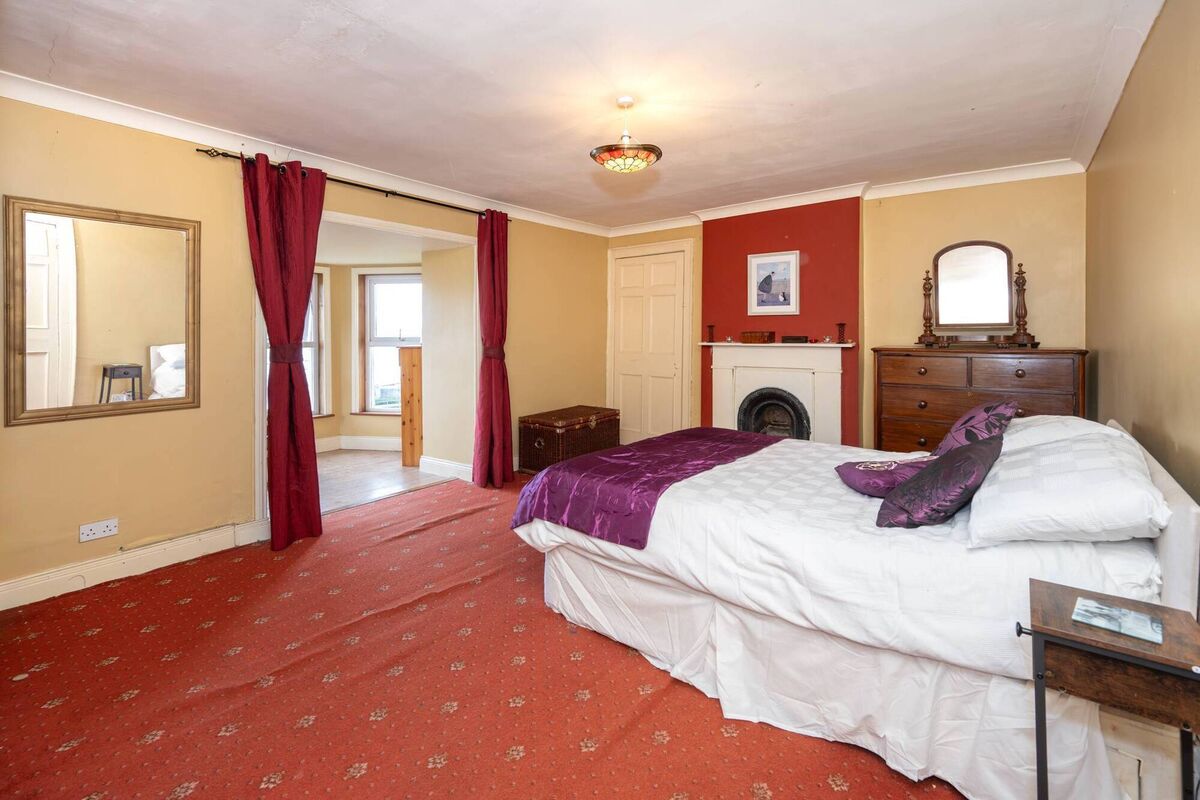 Bedroom with deep canted bay window