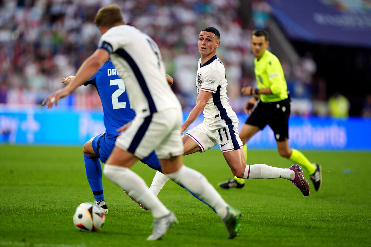 THANKS MATE: England's Phil Foden attempts a pass to team-mate Harry Kane against Slovenia. PIC Bradley Collyer/PA Wire. 
