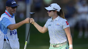 <p>Leona Maguire, of Ireland, fist bumps with her caddie. Pic: AP Photo/Lindsey Wasson</p>