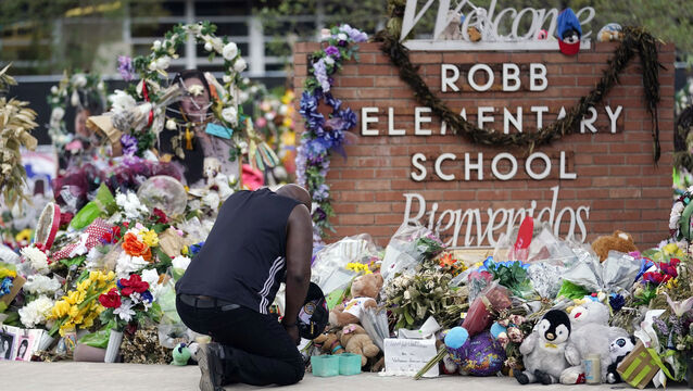 Reggie Daniels pays his respects at a memorial at Robb Elementary School, June 9, 2022, in Uvalde, Texas (Eric Gay/AP, File)