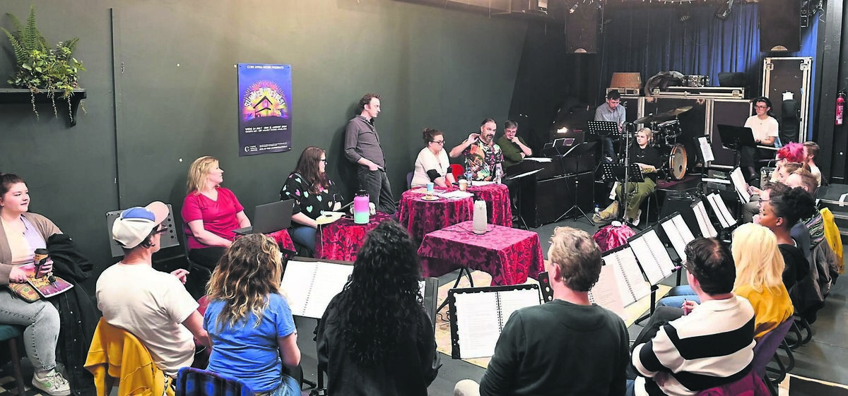 The cast of the Summer Revels in a production meeting.