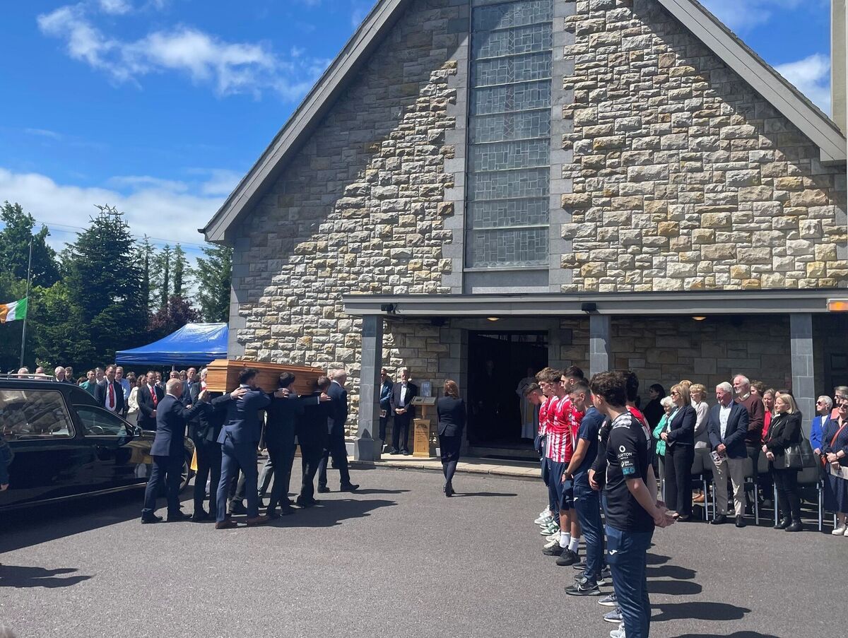 Sligo Rovers players line up as the coffin of veteran journalist Tommie Gorman is carried into in Our Lady Star of the Sea Church in Ransboro, Co Sligo for his funeral. Picture: PA Wire
