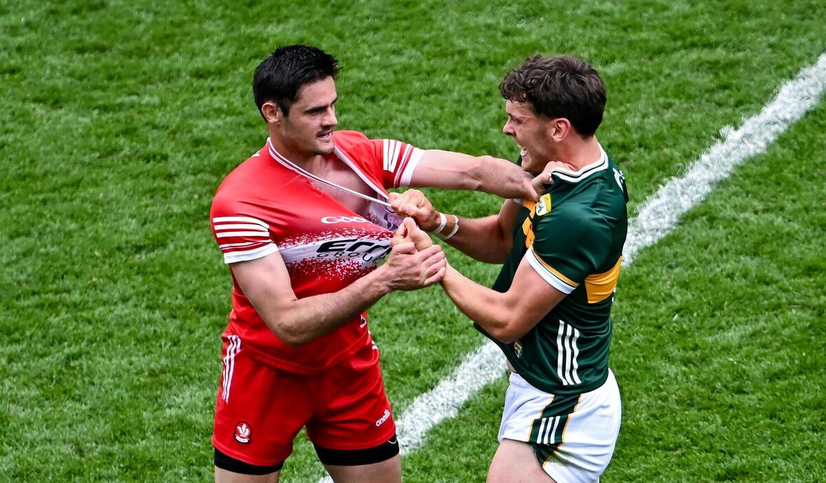 GETTING TO  GRIPS: Christopher McKaigue of Derry and David Clifford of Kerry tussle off the ball Photo by Piaras Ó Mídheach/Sportsfile