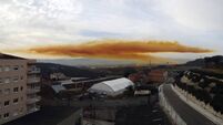 Toxic orange cloud spreads over towns after chemical explosion