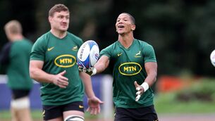 <p>Manie Libbok catches the ball watched by Jasper Wiese during a South Africa training session in 2023. (Photo by David Rogers/Getty Images)</p>