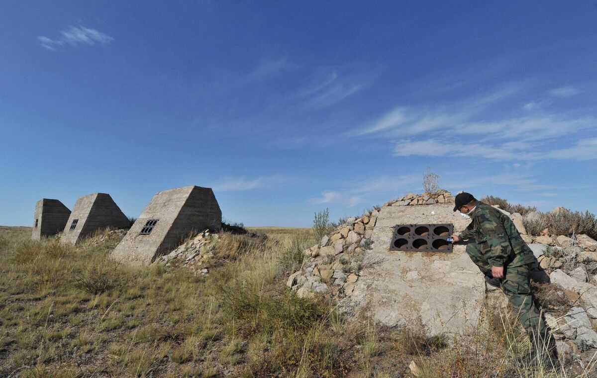 A specialist stands near equipment housings in the nuclear explosion site in Semipalatinsk. Picture via via Getty Images A specialist stands near equipment housings in the nuclear explosion site in Semipalatinsk. Picture via via Getty Images