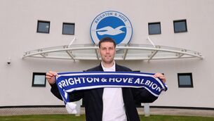 <p>Brighton and Hove Albion new manager Fabian Hurzeler holds up a club scarf</p>