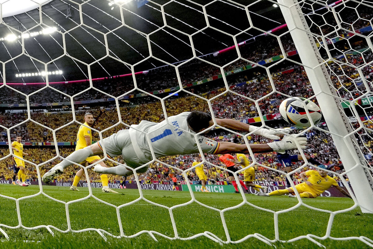 Romania's goalkeeper Florin Nita fails to block a shot on goal by Cody Gakpo. AP Photo/Antonio Calanni. Romania's goalkeeper Florin Nita fails to block a shot on goal by Cody Gakpo. AP Photo/Antonio Calanni.