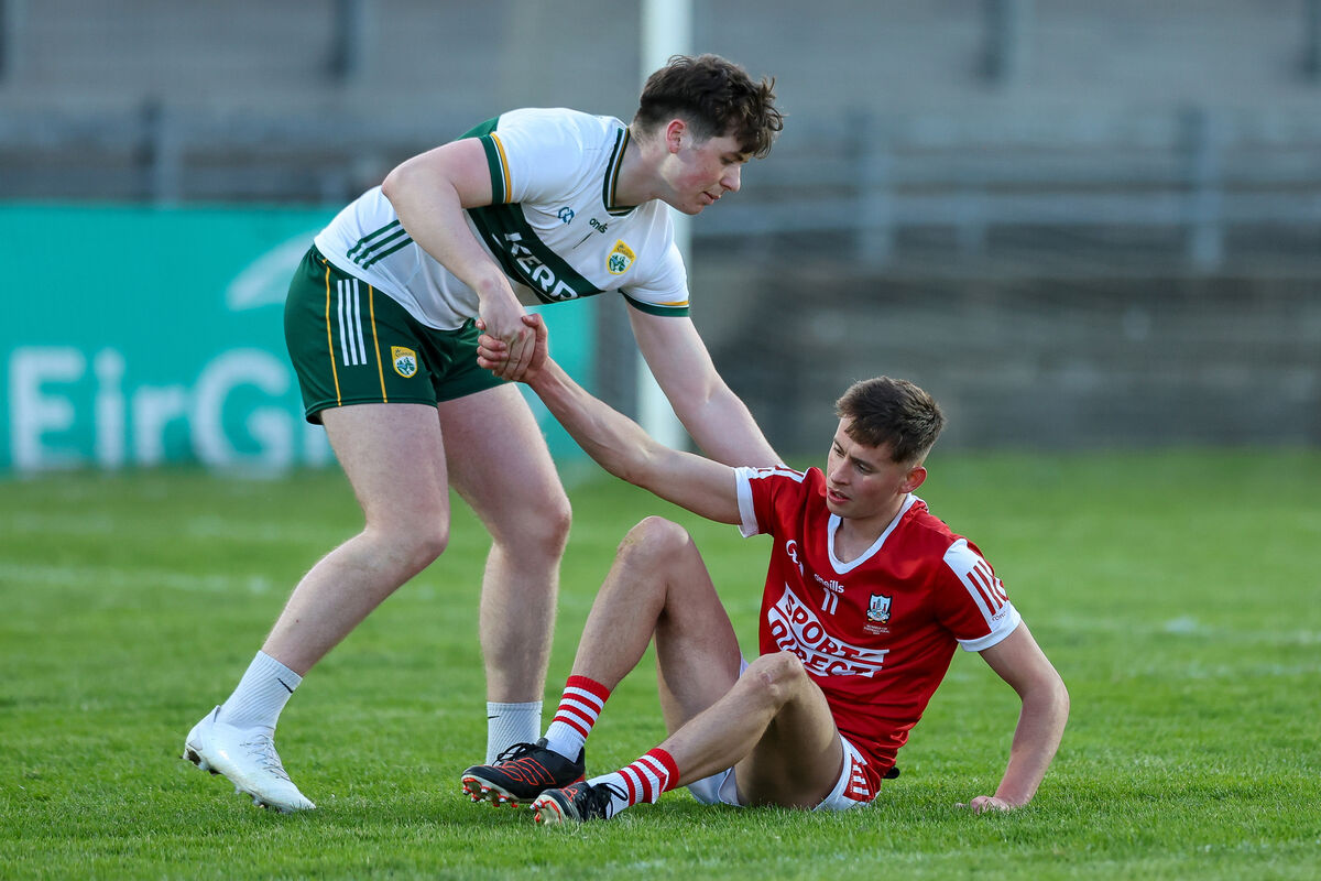 Kerry goalkeeper Michael Tansley gives Hugh O’Connor of Cork a hand up at the end of the Munster final this season. Picture: INPHO/Natasha Barton
