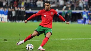 <p>Portugal's Cristiano Ronaldo takes a penalty against Slovenia in the Round of 16</p>