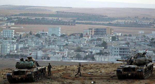Turkey helps Kurds cross into Syria to defend border town