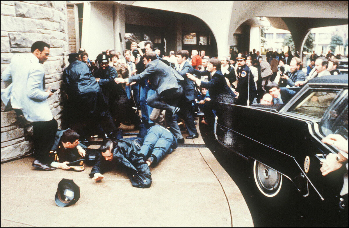 March 30, 1981: Police and Secret Service agents scramble to protect Ronald Reagan and seize gunman John Hinckley who fired six shots, one of which hit Reagan. The US president, then aged 70, made a remarkable recovery after the shooting. Mike Evens/AFP/Getty