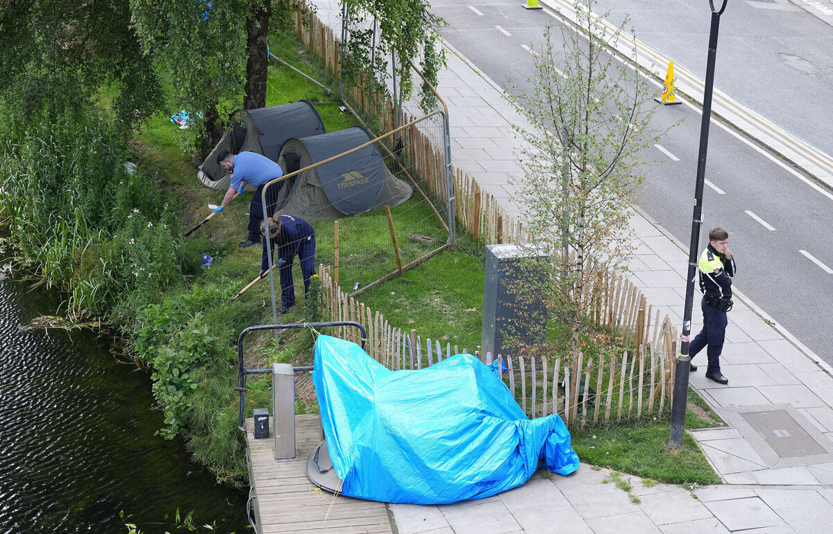 Gardaí carrying out searches at Grand Parade in Dublin after the bodies of two men were recovered from the Grand Canal on Saturday. Picture: Niall Carson/PA