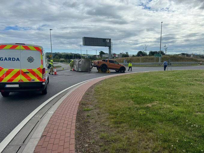 Gardaí and firefighters on the scene near the Dunkettle Interchange on the east side of Cork City where the livestock trailer being drawn by a Ford 4X4 overturned. 