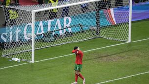 <p>Portugal's Cristiano Ronaldo reacts after missing a penalty during a round of sixteen match between Portugal and Slovenia. AP Photo/Michael Probst.</p>