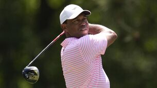 <p>Tiger Woods watches his tee shot on the fifth hole during the first round of the U.S. Open</p>