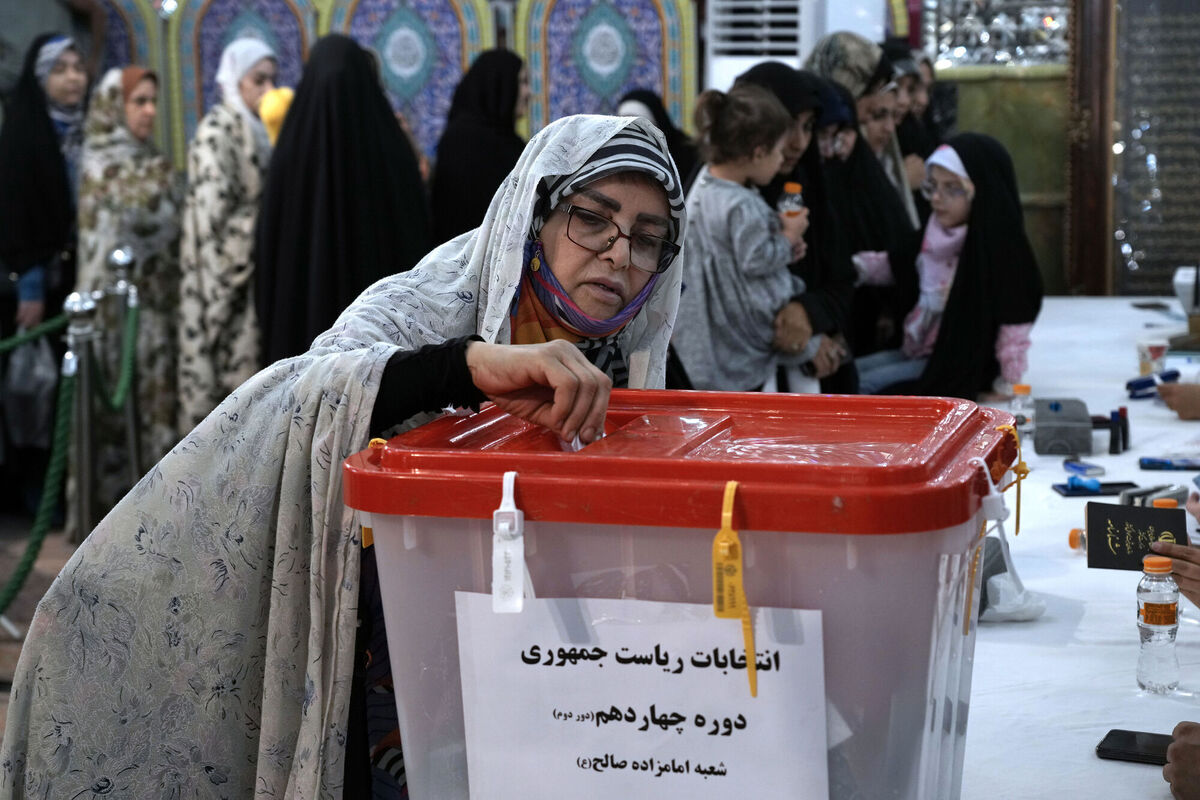 A woman casts her vote for the presidential election in a polling station at the shrine of Saint Saleh in northern Tehran, Iran, Friday, July 5. Picture: AP A woman casts her vote for the presidential election in a polling station at the shrine of Saint Saleh in northern Tehran, Iran, Friday, July 5. Picture: AP
