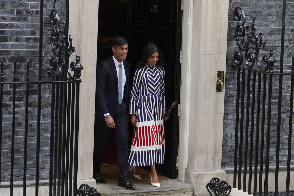 Rishi Sunak stands with his wife Akshata Murty following his party's landslide defeat to the Labour Party. Picture: Gareth Fuller/PA