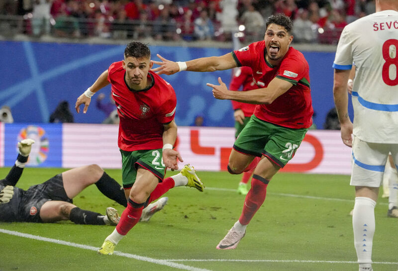 Portugal's Francisco Conceicao, centre, celebrates his late winner against Czech Republic