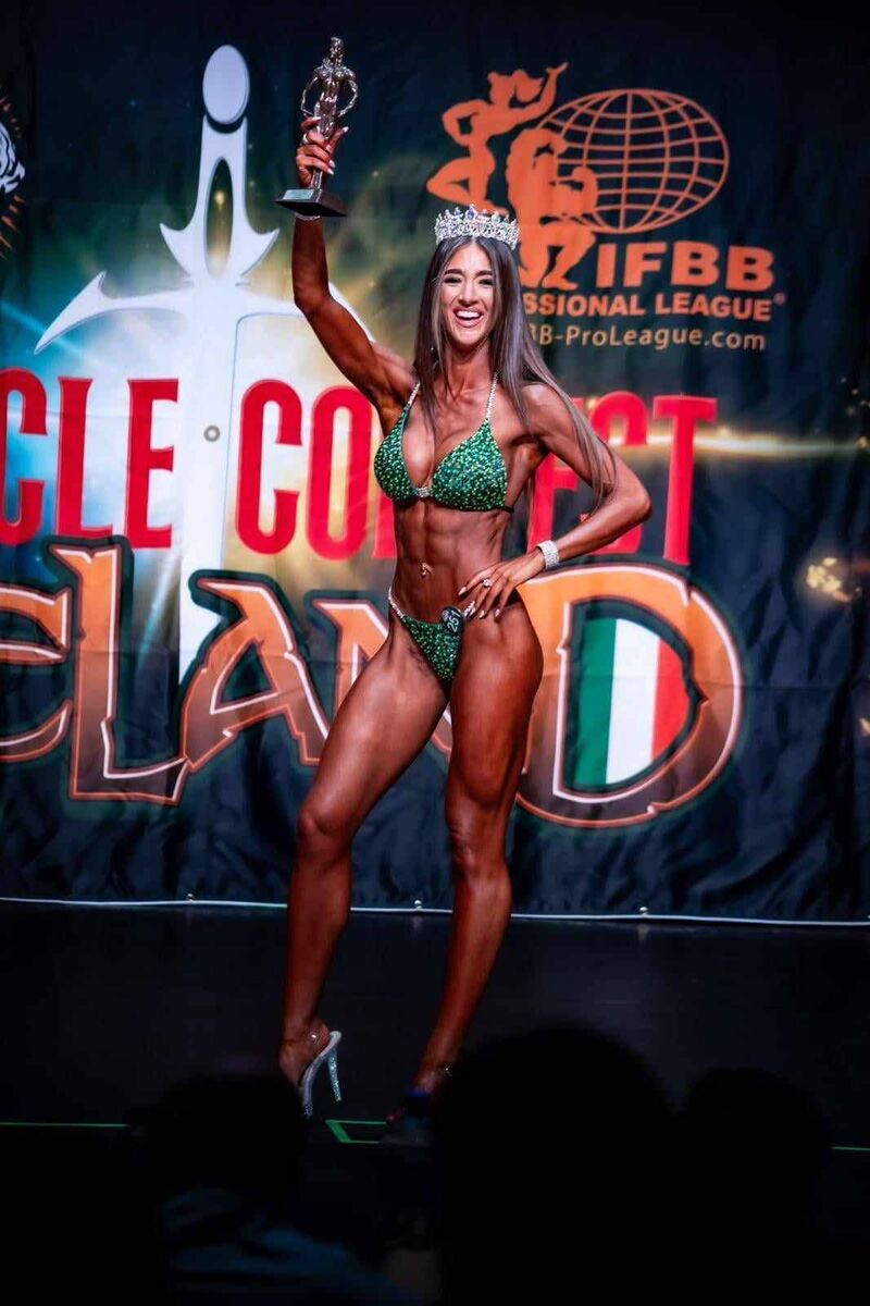 Cork secondary school teacher Eva Roche accepting her prize after winning in the bikini body building category in Muscle Contest Ireland.