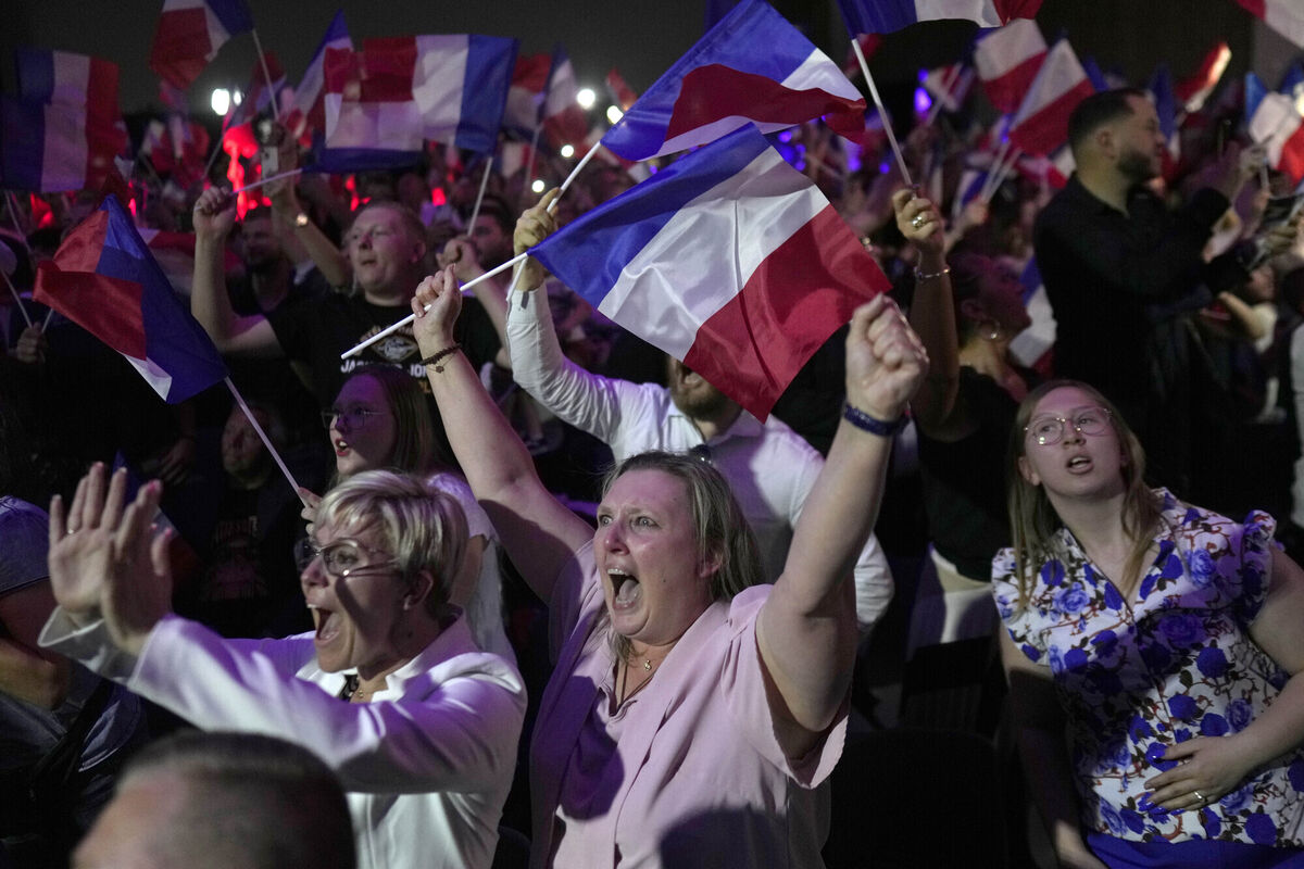 Supporters of French far right leader Marine Le Pen react after the release of projections based on the actual vote count in select constituencies , Sunday, June 30, 2024. Picture: Thibault Camus/AP