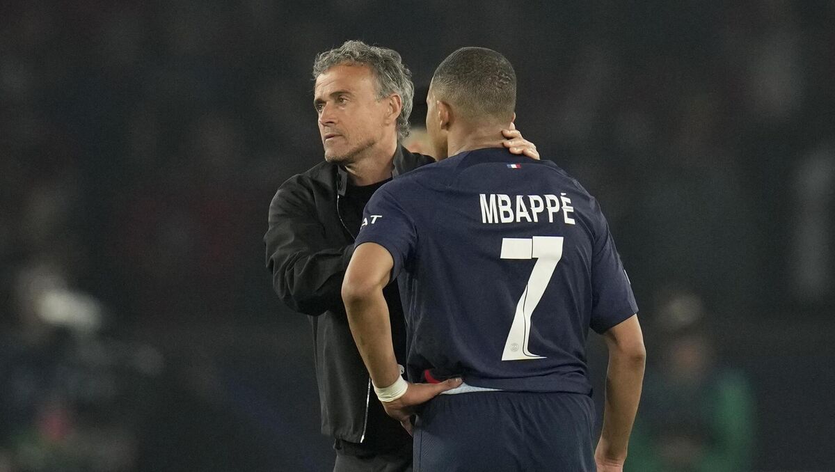 PSG's head coach Luis Enrique comforts Kylian Mbappe. AP Photo/Christophe Ena. PSG's head coach Luis Enrique comforts Kylian Mbappe. AP Photo/Christophe Ena.