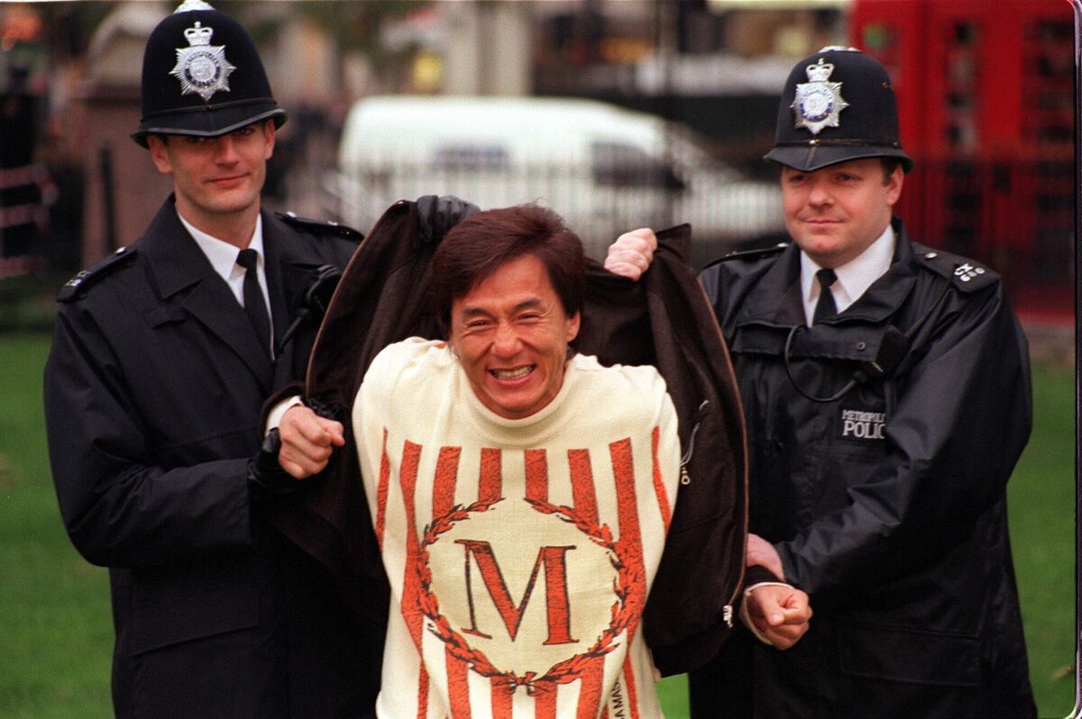 Actor Jackie Chan with Metropolitan police officers during a 1998 photocall in London's Leicester Square.