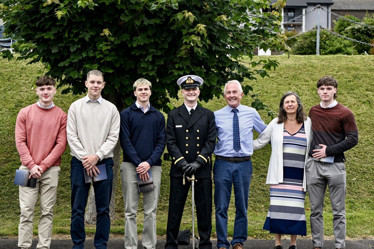 New Naval Officer Cameron Clerkin (centre) with family and friends, (left to right) Ben Ryan, Luke O’Driscoll, Duncan Walsh, Bob Walsh, Rowena Walsh and David Ryan at the commissioning ceremony on Friday. Picture: Chani Anderson