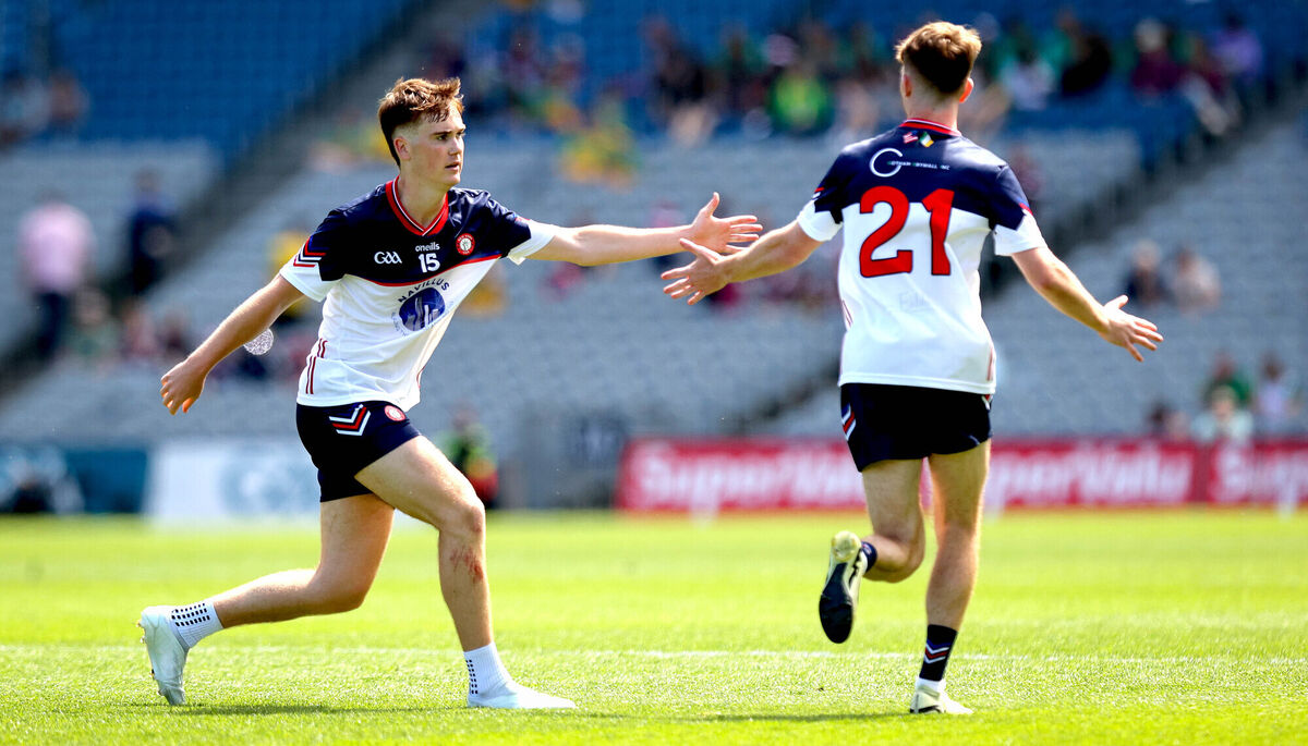 New York’s Shay McElligott celebrates a score with Lorcan Kennedy. Picture: ©INPHO/Ryan Byrne