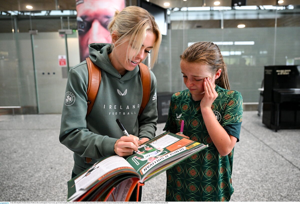 Republic of Ireland's Denise O'Sullivan with a tearful supporter Nessa Coveney, age 11, from Carrigaline, Cork, on the teams arrival at Cork Airport ahead. Photo by Stephen McCarthy/Sportsfile Republic of Ireland's Denise O'Sullivan with a tearful supporter Nessa Coveney, age 11, from Carrigaline, Cork, on the teams arrival at Cork Airport ahead. Photo by Stephen McCarthy/Sportsfile