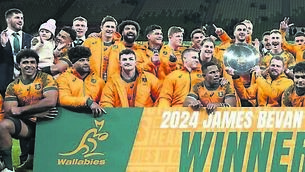 <p>Australia teammates pose with their trophy after defeating Wales in their rugby union test match and two-game series in Melbourne. Picture: Asanka Brendon Ratnayake/AP</p>