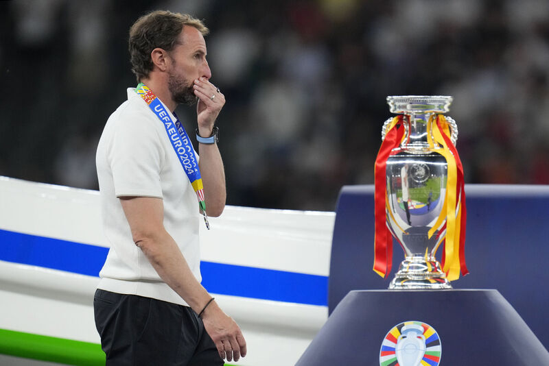 England's manager Gareth Southgate walks past the trophy. Pic: Manu Fernandez, AP
