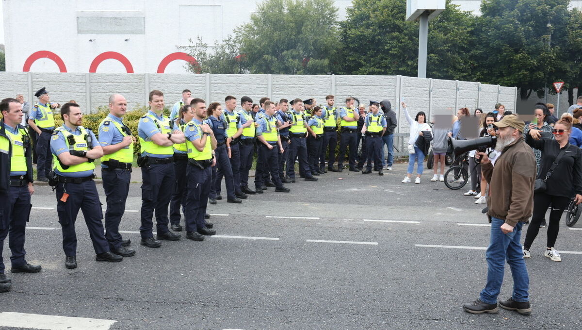 Gardaí, residents and protesters outside the former Crown Paints factory in Coolock, Dublin. Picture: Colin Keegan/Collins Photos