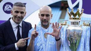 <p>Manchester City's head coach Pep Guardiola, right, and Manchester City chairman Khaldoon Al Mubarak celebrate with the Premier League trophy. Pic: Dave Thompson, AP</p>