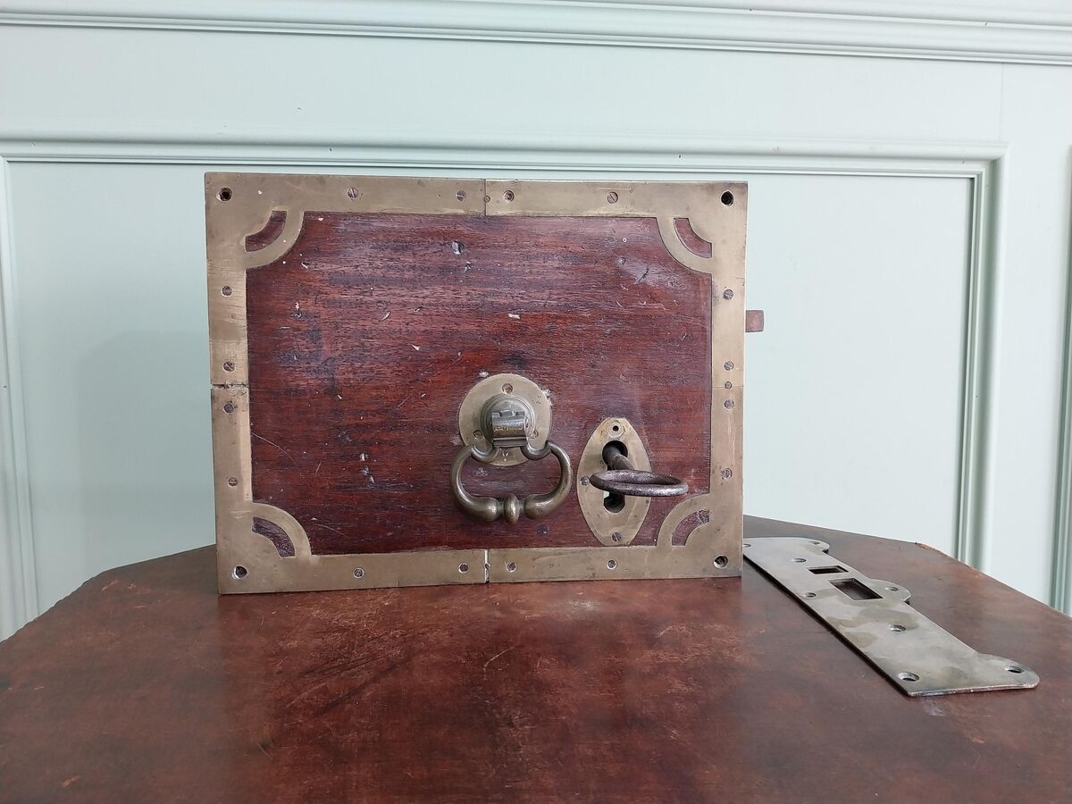 An Irish Georgian mahogany and brass door lock. An Irish Georgian mahogany and brass door lock.