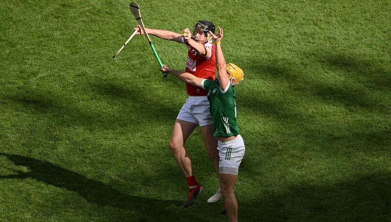 RISING HIGHEST: Cork's Rob Downey in action against Limerick's Tom Morrissey. Pic: Daire Brennan/Sportsfile