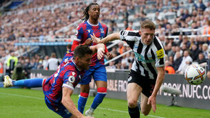 <p>Crystal Palace's Joel Ward (left) and Newcastle United's Elliot Anderson battle for the ball. Pic: Owen Humphreys/PA Wire.</p>