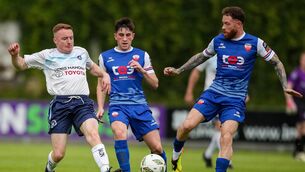 <p>Jamie Hamilton of Kilbarrack United in action against Colin Conroy, centre, and Lee J Lynch of Treaty United. Picture: Michael P Ryan/Sportsfile</p>