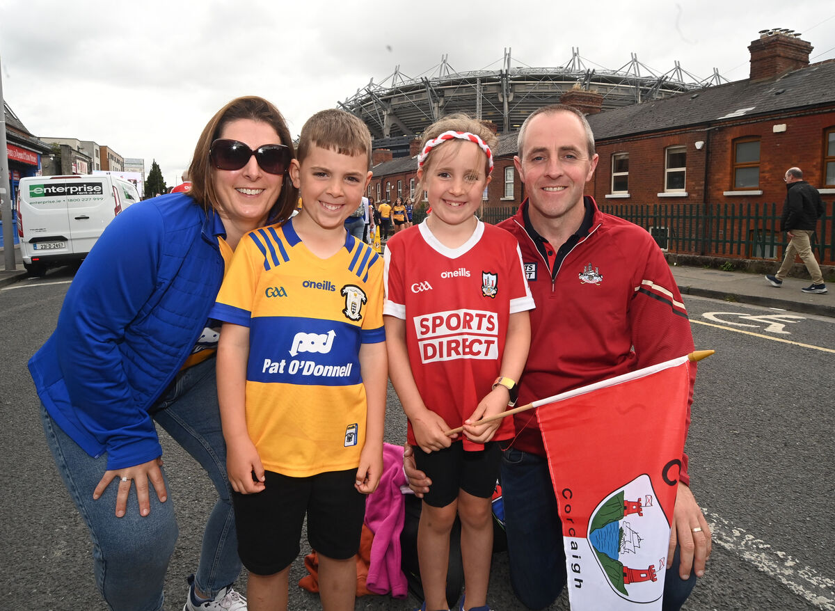 Parents Richard and Mairead and children Micheal and Roisin from Ballineen, Cork divided their support for Clare and Cork showdown. Picture: Larry Cummins