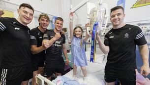 <p>All-Ireland hurling champions Clare brought the Liam MacCarthy Cup to Children’s Health Ireland at Temple Street for a special visit. Pictured is Isla Timmins (3) from Donaghmede Co Dublin with players David Fitzgerald, Peter Duggan, John Conlon and Tony Kelly. Picture Andres Poveda</p>